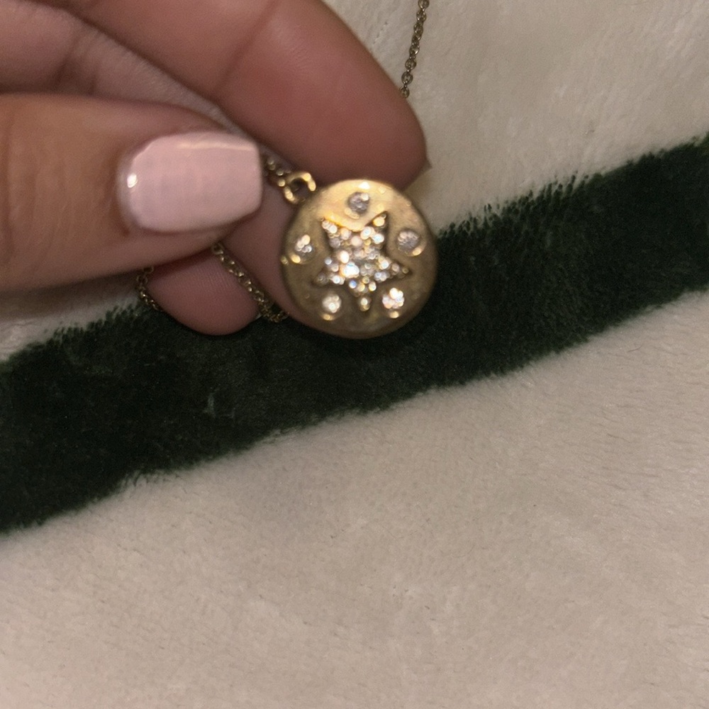 Cute necklace with star on one side and the moon on the other side